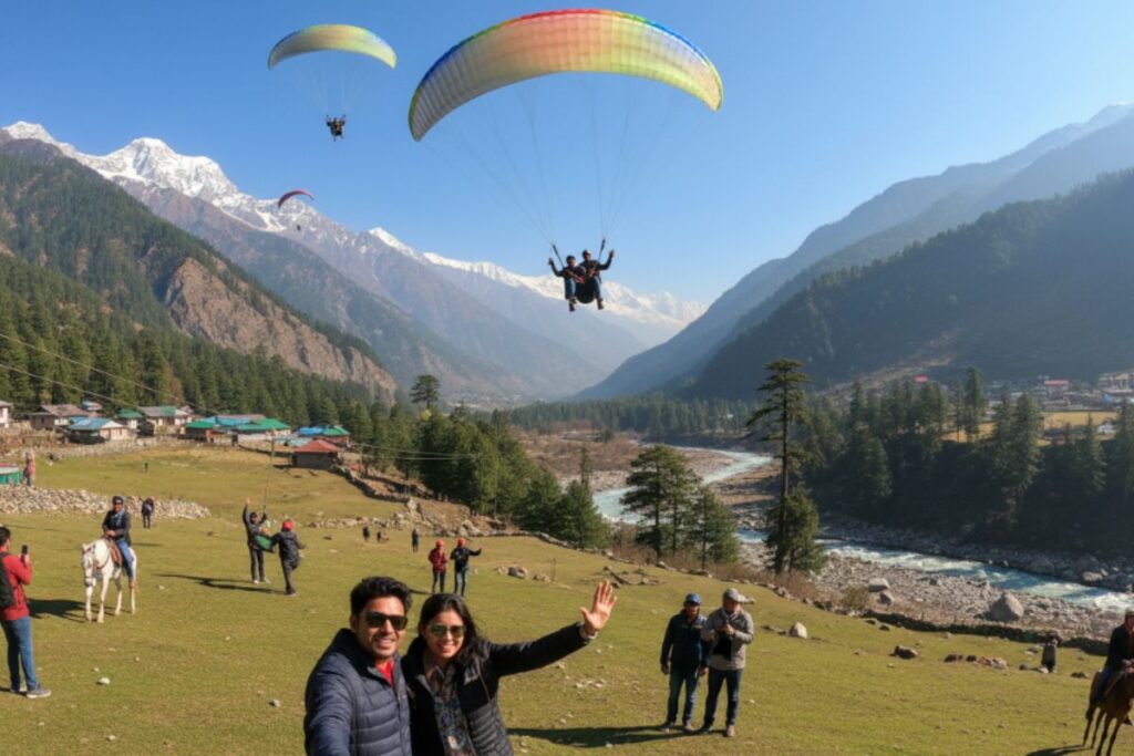 A group of happy travelers enjoying scenic snow-capped mountain views in Himachal Pradesh during a 7-day Manali–Solang Valley–Shimla group tour package.