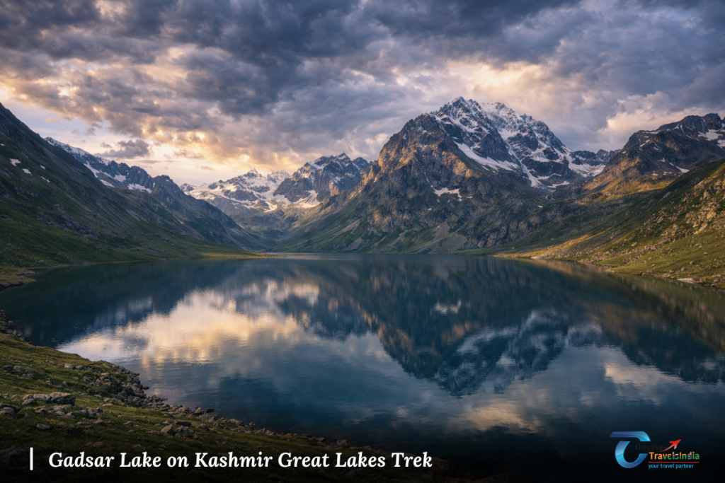 High-altitude Gadsar Lake surrounded by rugged mountains during a Kashmir trek