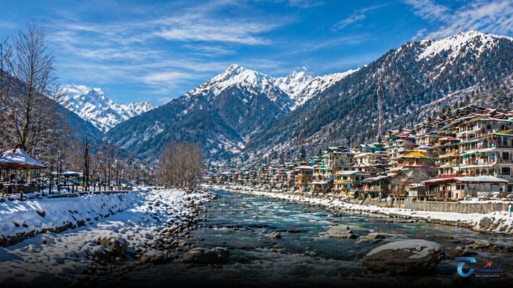 Scenic sunset view of Manali with the Beas River flowing through the valley and snow covered Himalayan peaks in the background